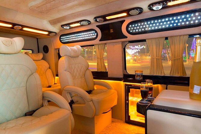 Reclining leather armchairs inside a nine-seat limousine van