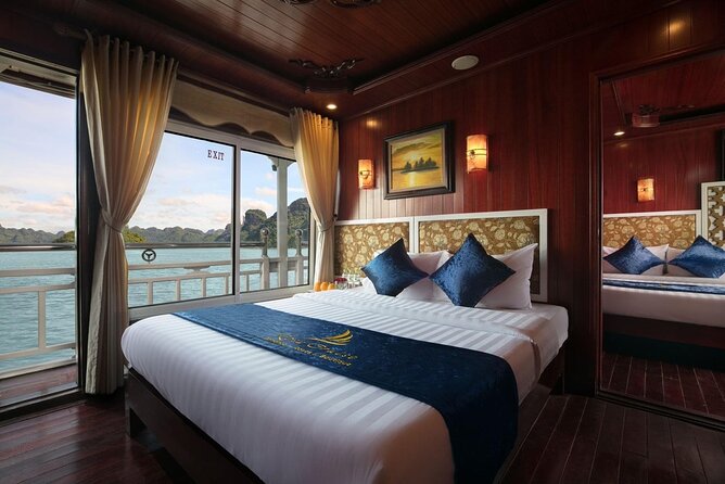 From Hanoi: 2D1N Ha Long Bay Deluxe Cruise with Bus Limousine - Day one: lunch, Titop Island, and the first sunset