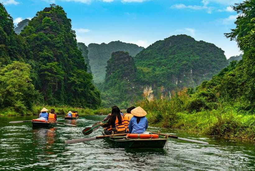 Hoa Lu, Tam Coc, & Mua Cave Day Trip with Lunch & Limousine - Tam Coc by boat on the Ngo Dong River