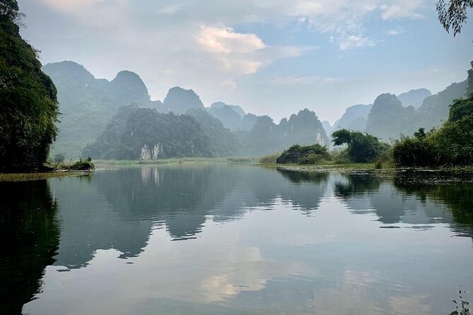 Hoa Lu - Tam Coc - Mua Cave Full Day - LIMOUSINE - Cycling toward Bich Dong Pagoda